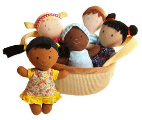 Snuggle Stuffs diverse dolls embrace differences in a close-up portrait.