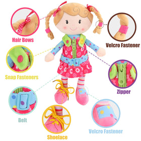 Snuggle Stuffs Sugar Snap doll shows buttoning practice for fine motor skills.