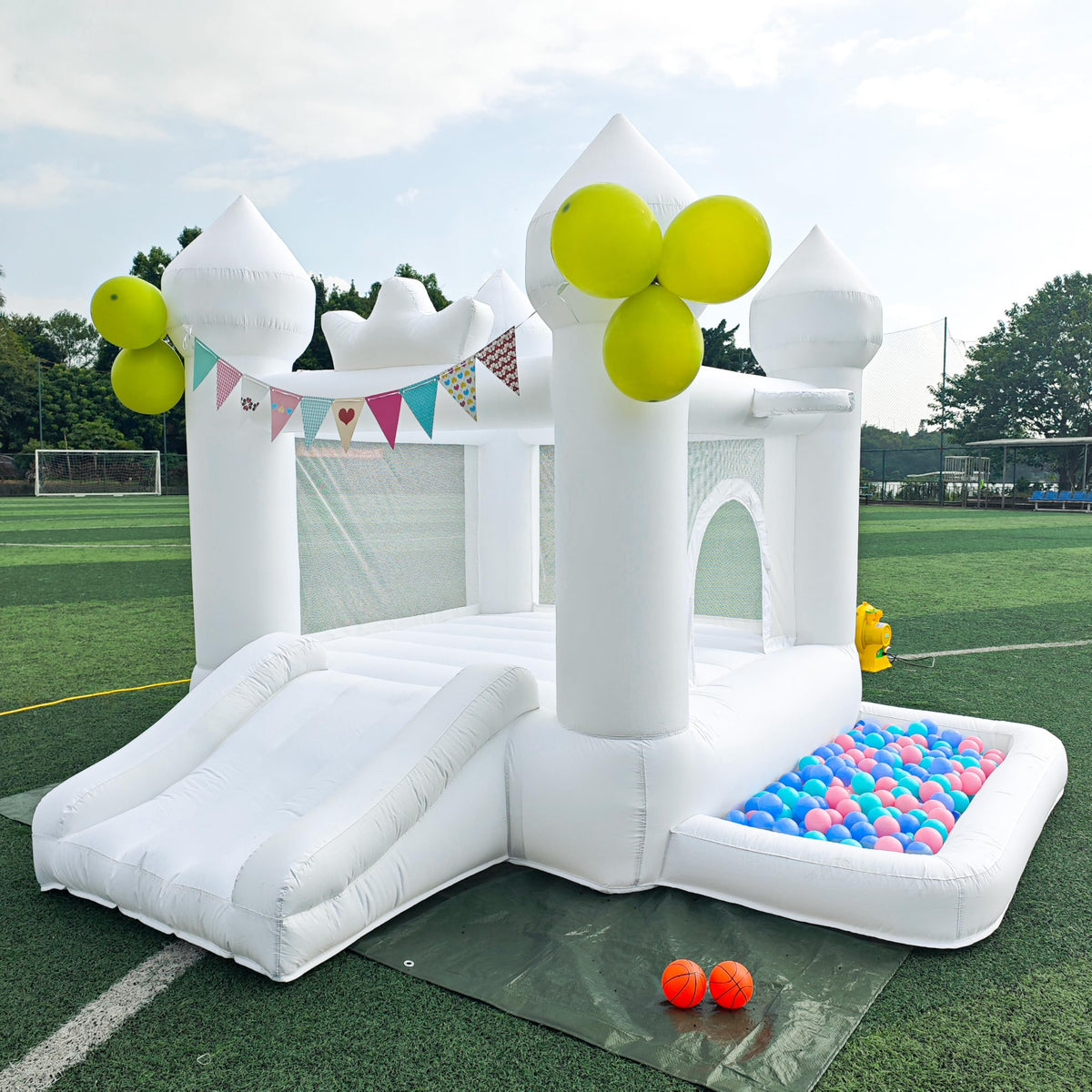 SnuggleBounce 9FT white bounce house front view for outdoor play and photos
