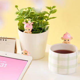 Sonny Angel Cherry Blossom Hippers on desk displaying cute vibe.