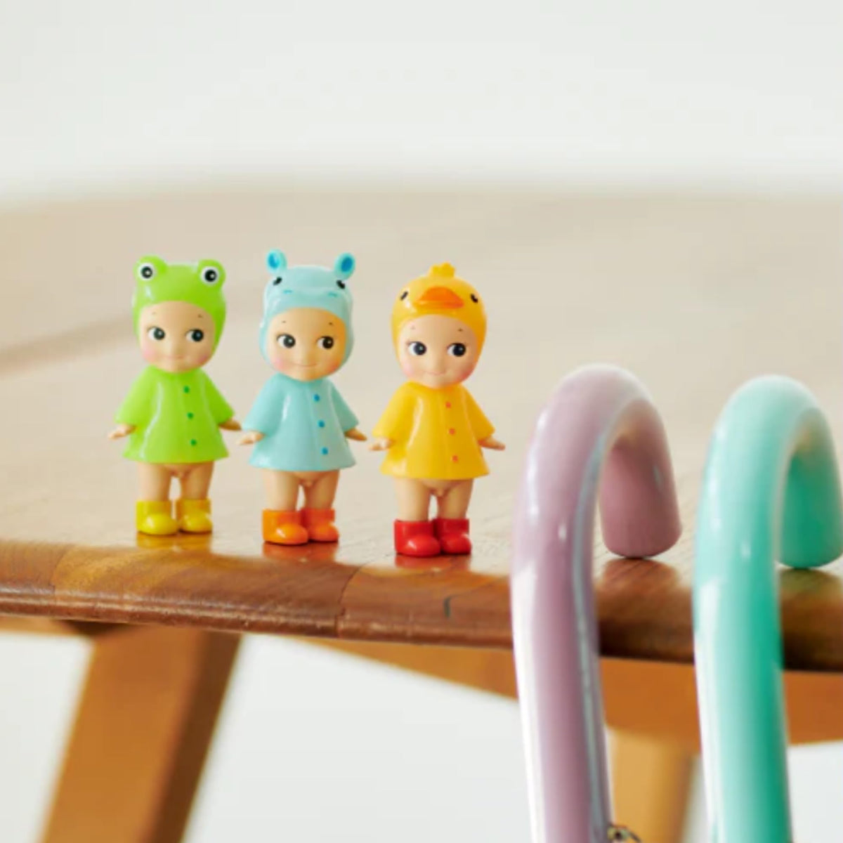Sonny Angel display by window or shelf enhances mood with glossy rainwear charm.