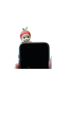 Unboxed Sonny Angel Hippers Harvest figure beside packaging