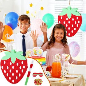 Sosation strawberry pinata used as a colorful centerpiece.