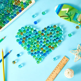 Sotiff colorful marbles suitable for Chinese checkers and classroom games.