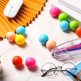 Sotiff pink stress ball in palm highlighting ergonomic grip.