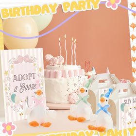 Soulchen birthday decor display showing plush geese and props in a scene.