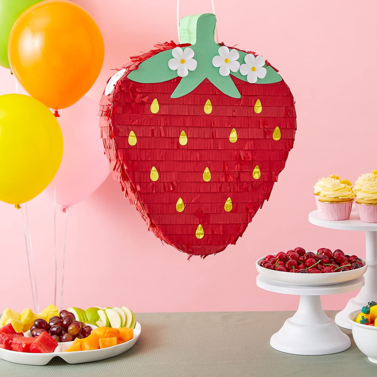 Sparkle and Bash pinata with daisies adds floral charm to garden parties.