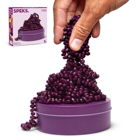 Speks Crags ferrite stones in a tin for mess-free tactile play at the desk.