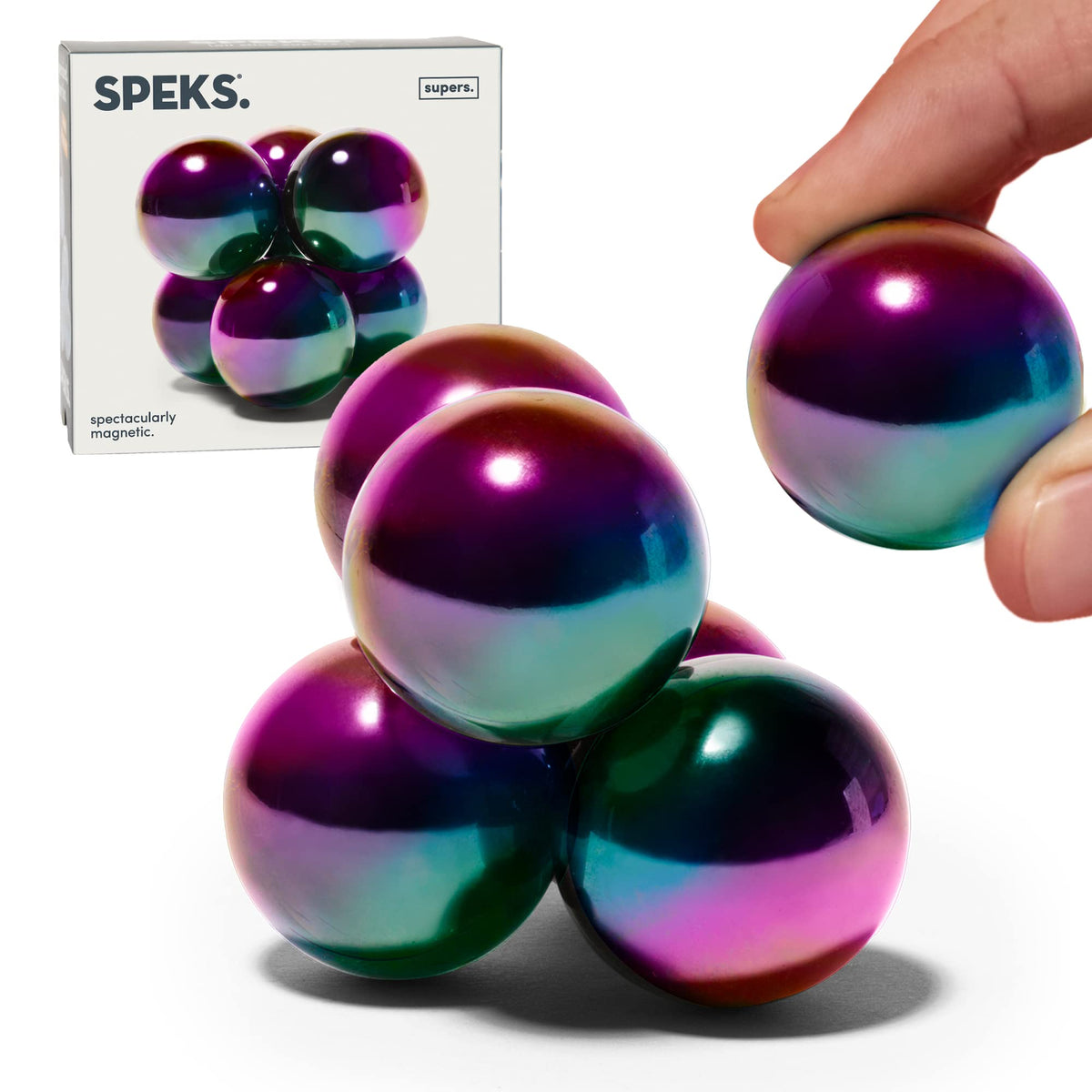 Speks Supers oil slick magnetic balls front view for desk focus.