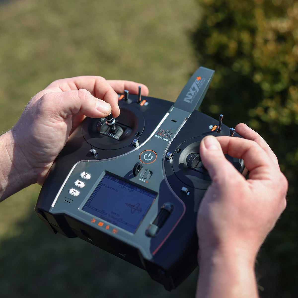 Spektrum NX7e+ Black Edition back view highlighting compact storage profile.