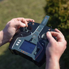 Spektrum NX7e+ Black Edition back view highlighting compact storage profile.