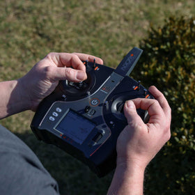 Spektrum NX7e+ Black Edition display close-up showing the 2.8-inch color screen.