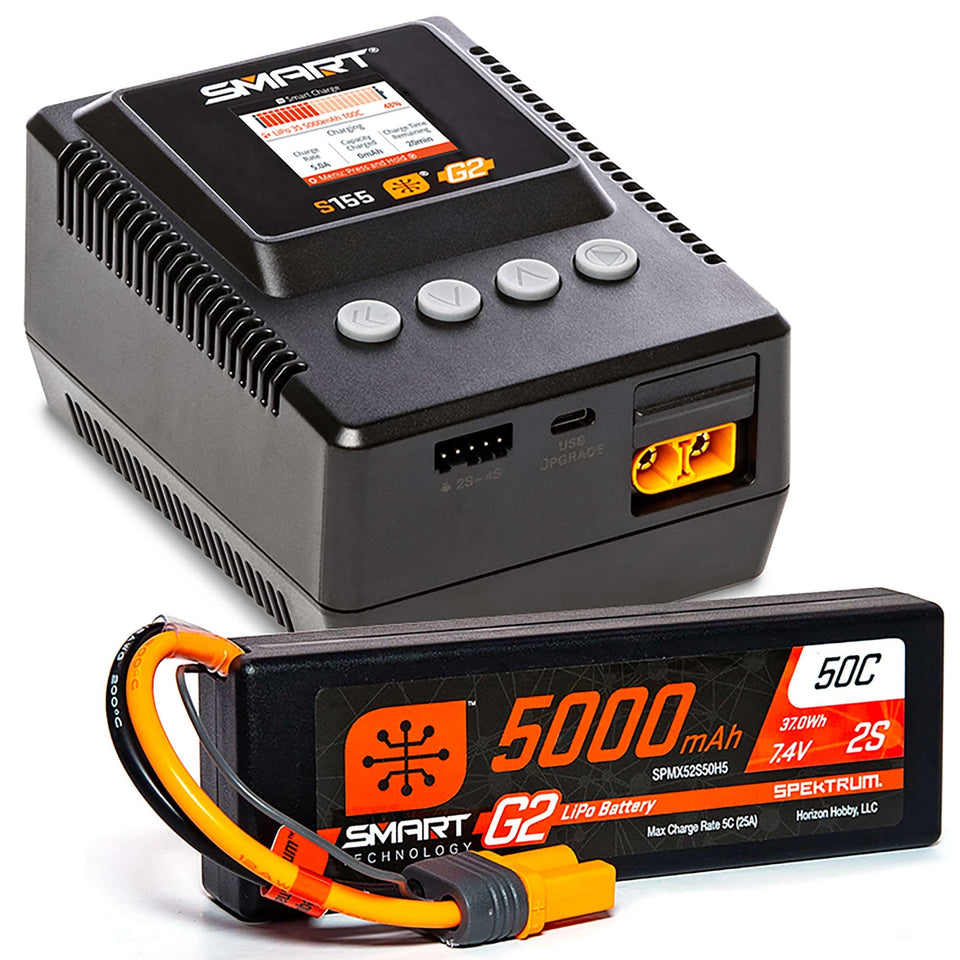 Spektrum Smart Powerstage Surface Bundle on a workbench, ready for fast, balanced charging sessions.