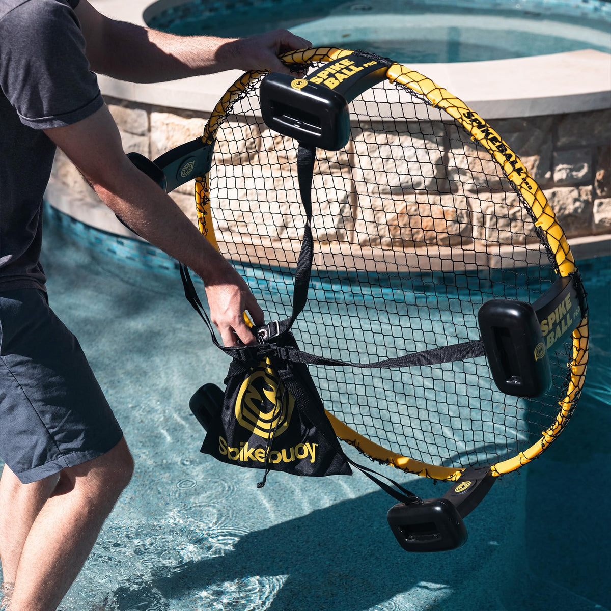 Spikeball Spikebuoy beach scene emphasizes portable water game fun