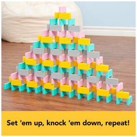 Spin Master 2D domino pyramid demonstrates multi-layer building.