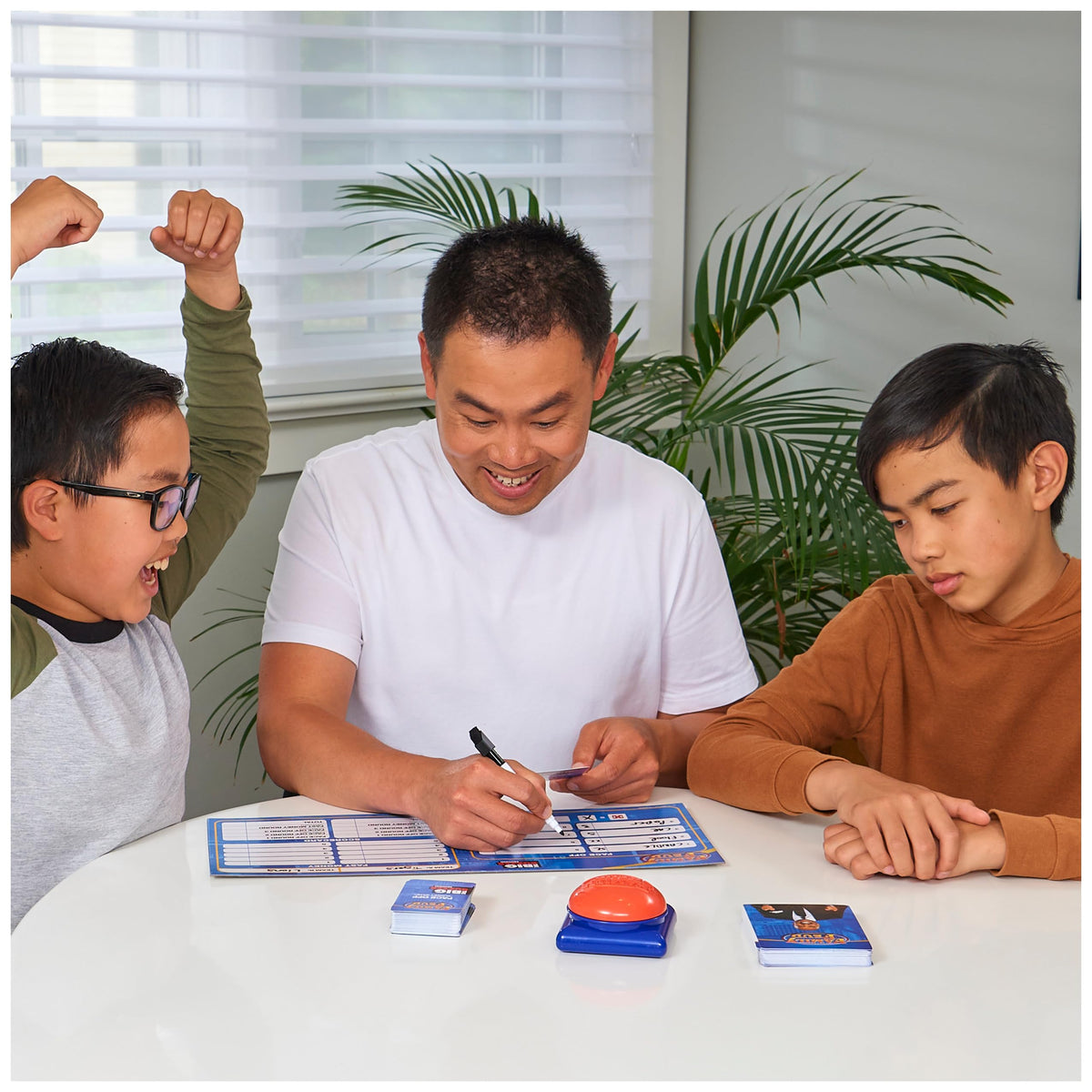 Dry erase scoreboard from Spin Master Family Feud Big Buzzer ready for scoring
