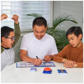 Dry erase scoreboard from Spin Master Family Feud Big Buzzer ready for scoring