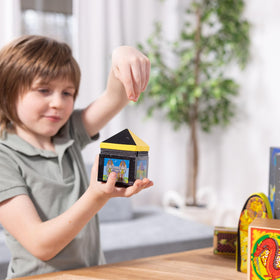 Spin Master Melissa and Doug deluxe wooden magic set shows disappearing ball trick in action.
