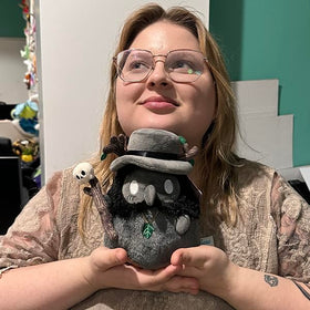 Squishable Druid Plague Doctor side view plush, ideal for snug hugging at your workspace.