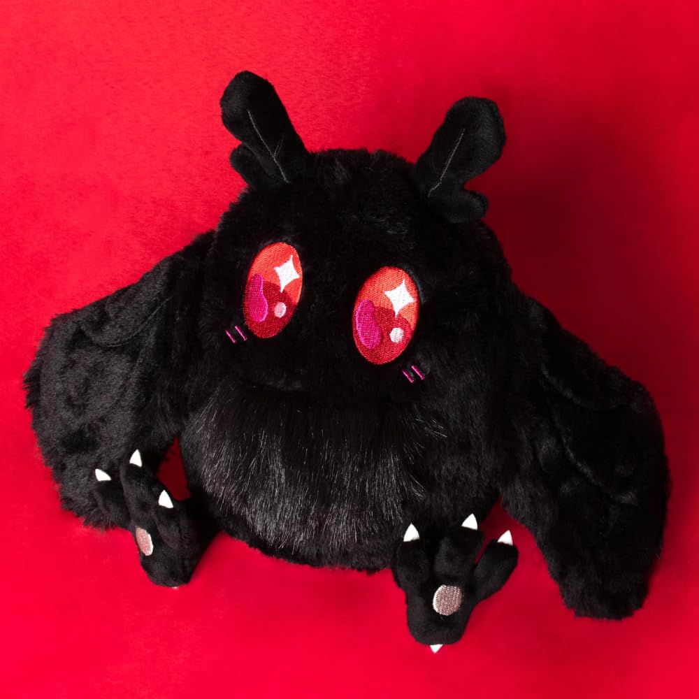 Squishable mini goblincore mothman on shelf display within a collection