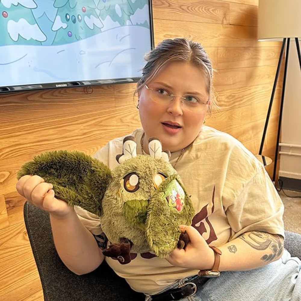 Squishable mini goblincore mothman wing magnets demonstrating foldable wings for self-hugs