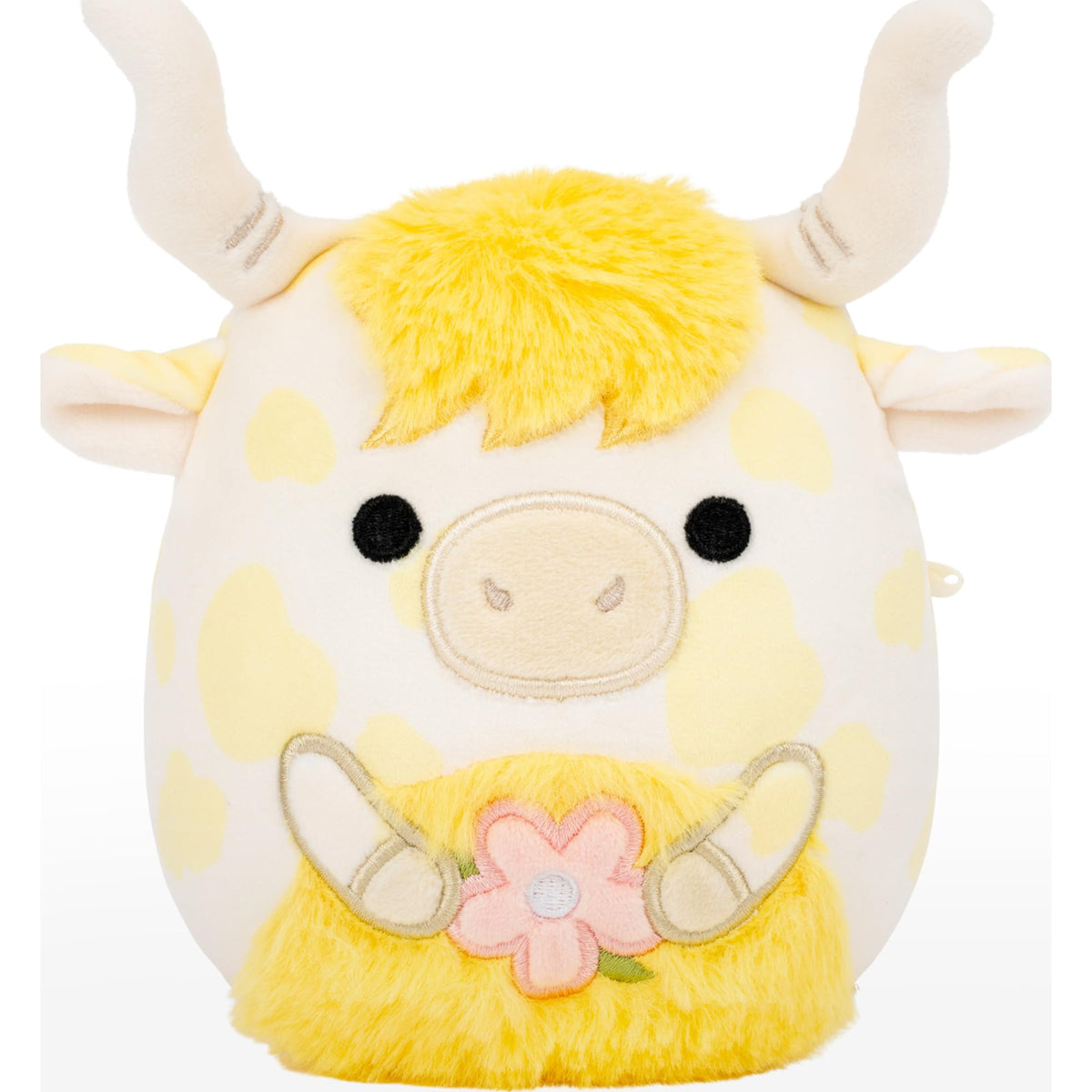 Larkin the yellow spotted Highland cow holding flower, a bright springtime cuddle buddy.