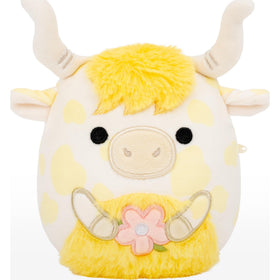 Larkin the yellow spotted Highland cow holding flower, a bright springtime cuddle buddy.