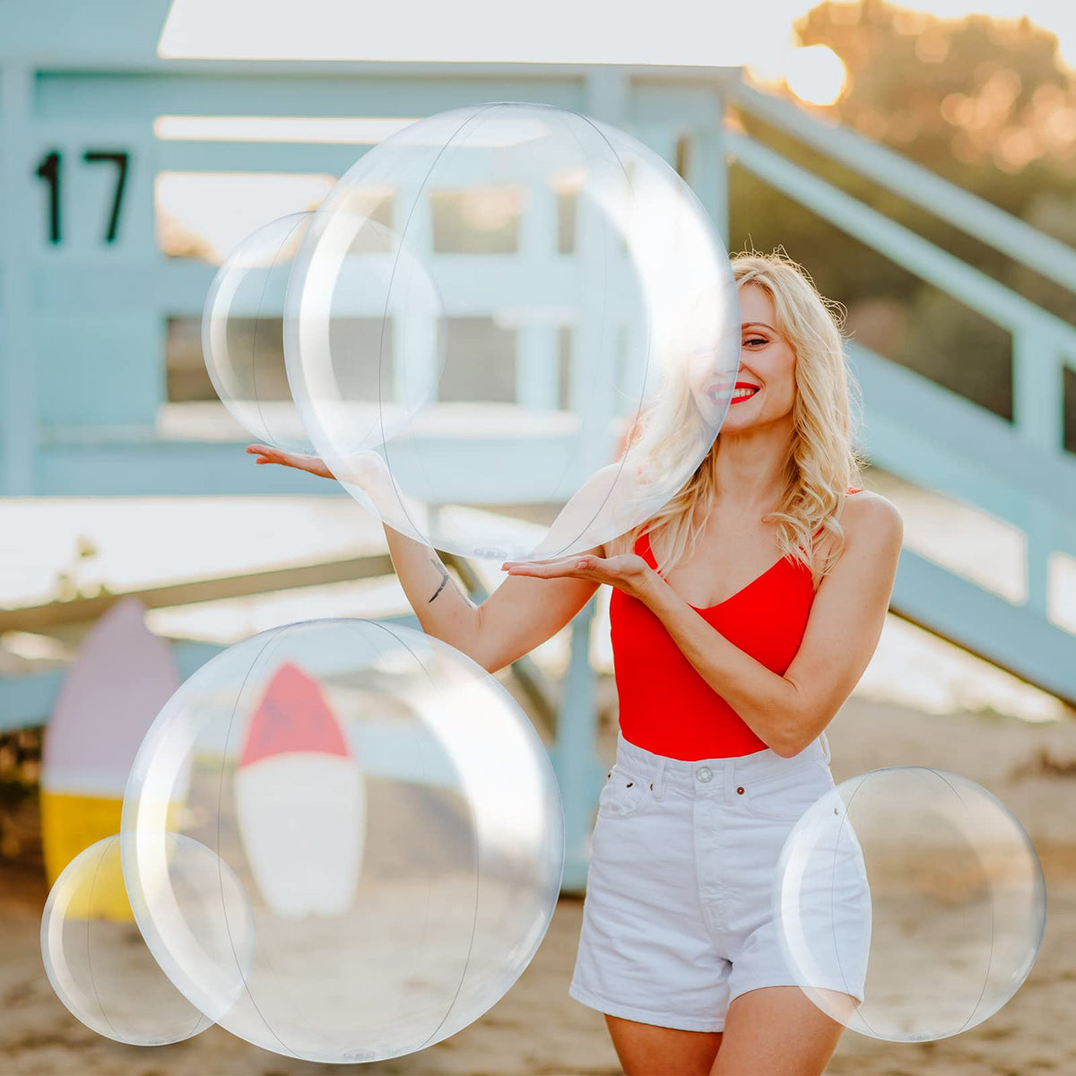 Sratte clear inflatable beach ball during a party scene, great for beach and pool events.