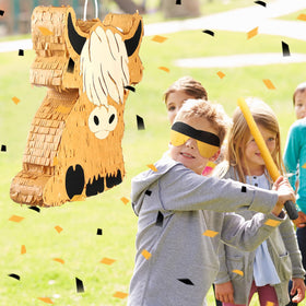 Sratte Highland Cow pinata blindfold setup for a playful game.