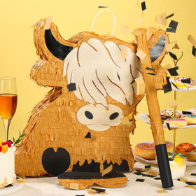 Sratte Highland Cow pinata filling hole with sticker visible.