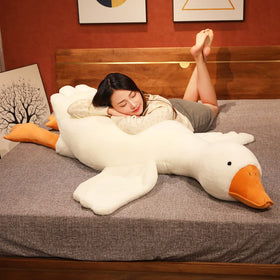 Srutirbo goose plush used as hug pillow on sofa or couch.