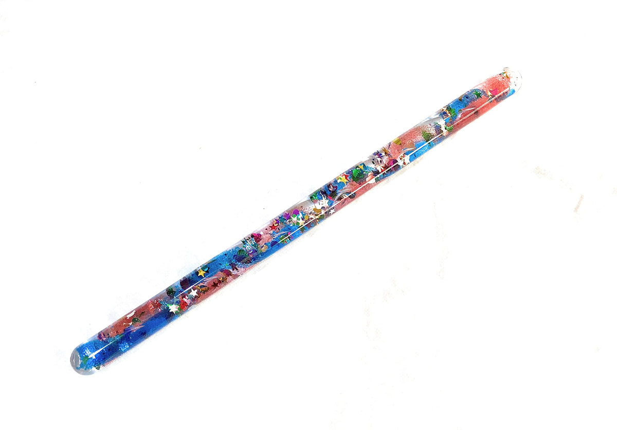 Star Magic glitter tube close-up showing swirling glitter