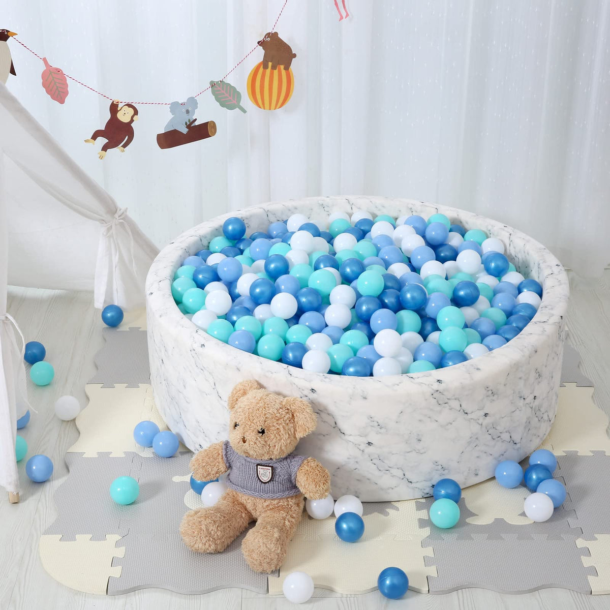 STARBOLO ball pit setup in a cozy playroom