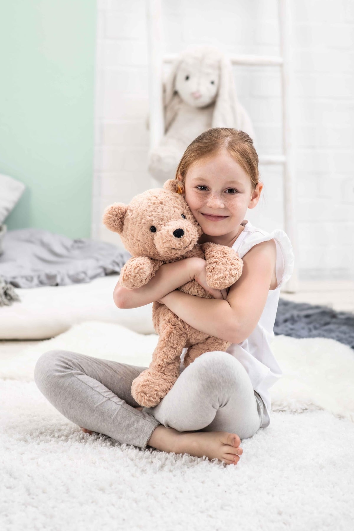Steiff Jimmy Teddy Bear encourages imaginative play with a floppy, friendly pose.