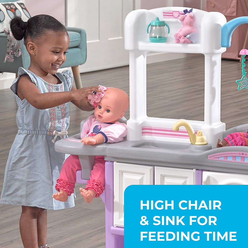 Step2 Love and Care Deluxe Nursery changing table doubles as a crib with mobile for bedtime pretend play.