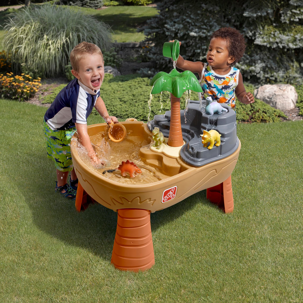 Step2 Dino Dig two-compartment design supports simultaneous sand and water fun.