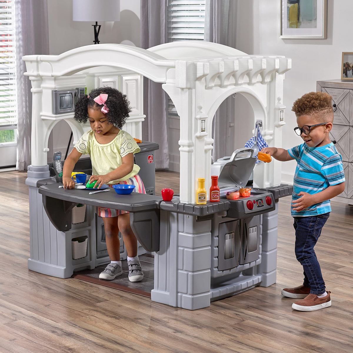 Step2 Grand Walk-In Kitchen and Grill large countertop supports busy pretend prep.