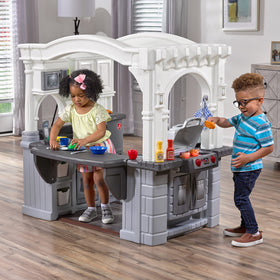 Step2 Grand Walk-In Kitchen and Grill large countertop supports busy pretend prep.