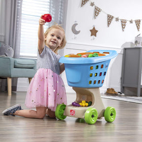 Step2 Little Helper's Shopping Cart doll seat featured, inviting dolls to join pretend shopping
