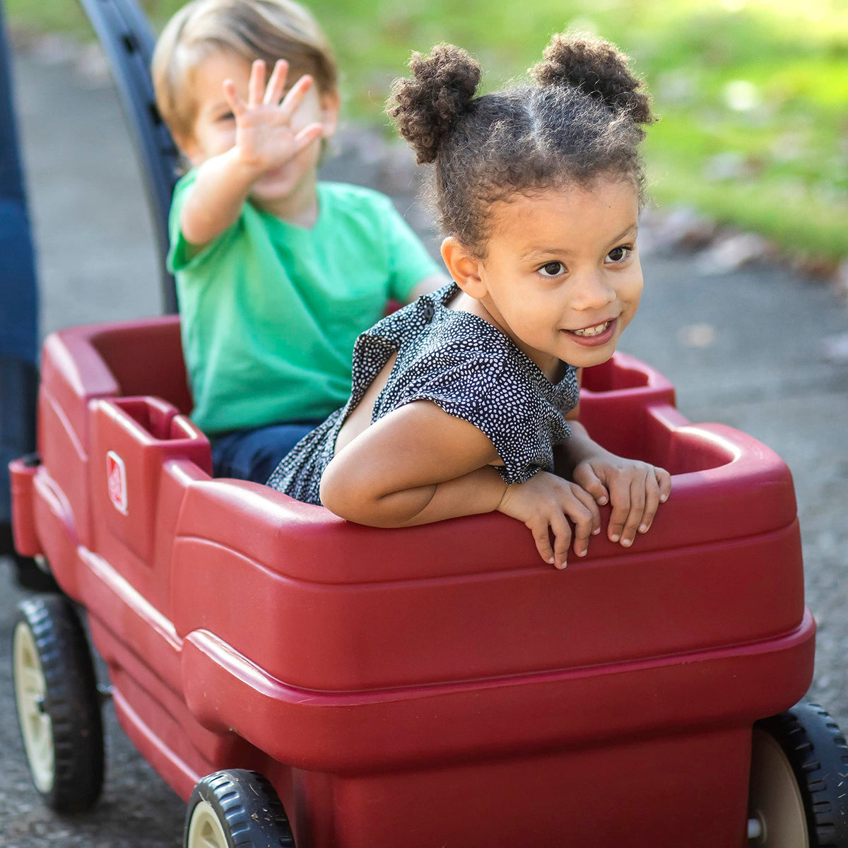 Step2 Neighborhood Wagon side storage keeps snacks and toys within easy reach.