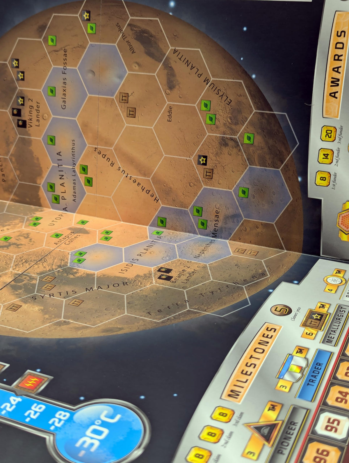 Stronghold Games Terra Cimmeria map side highlights new awards for deeper competition.