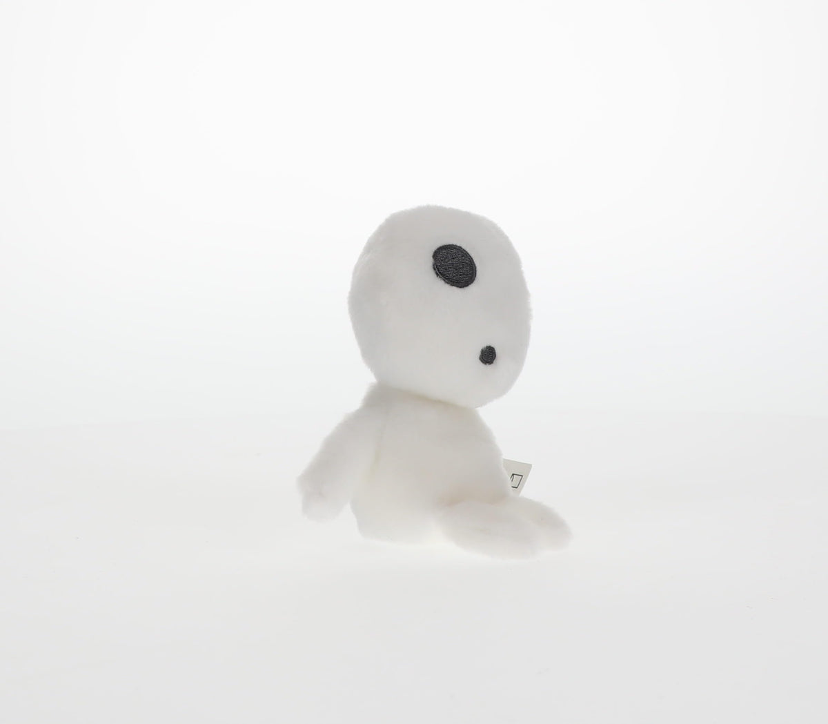 Display-ready Kodama plush companion for anime room.