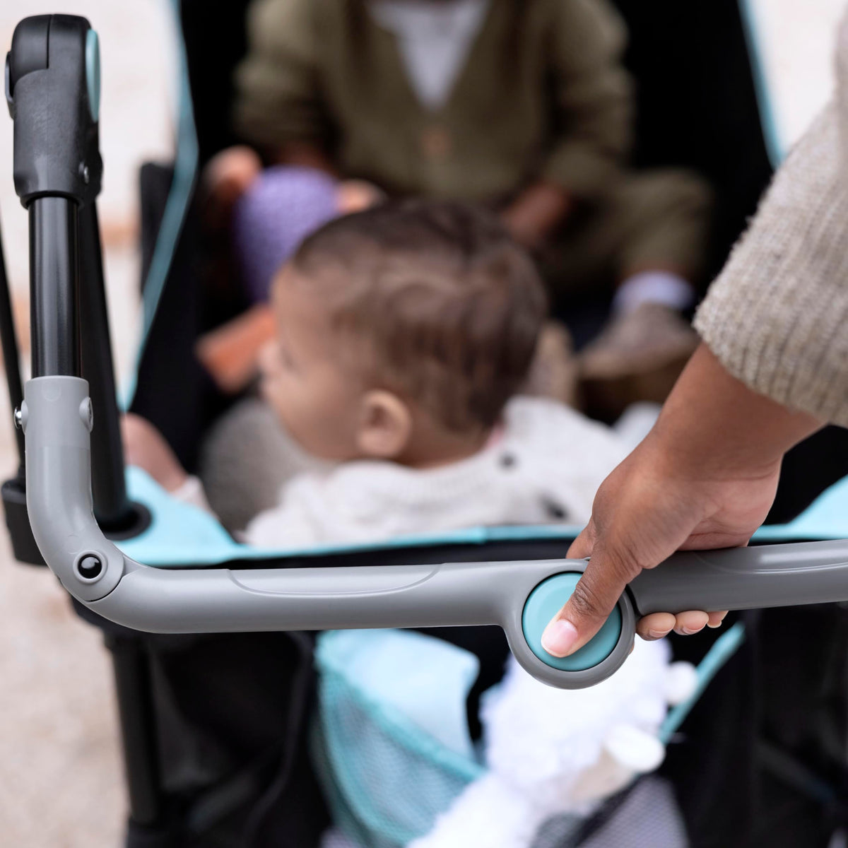 Summer Infant Pop 'N Ride features four-wheel suspension for smooth rides.