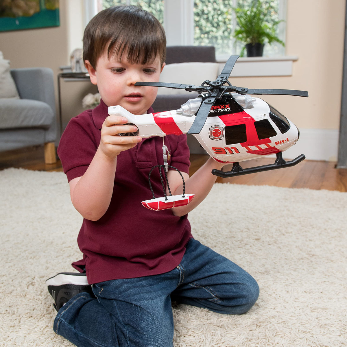 Sunny Days Entertainment Maxx Action Helicopter extendable ladder reaches high play areas.
