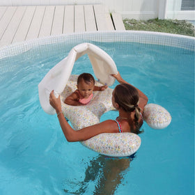 Sunnylife baby floaties with soft leg cradles support comfortable seating for tiny swimmers.