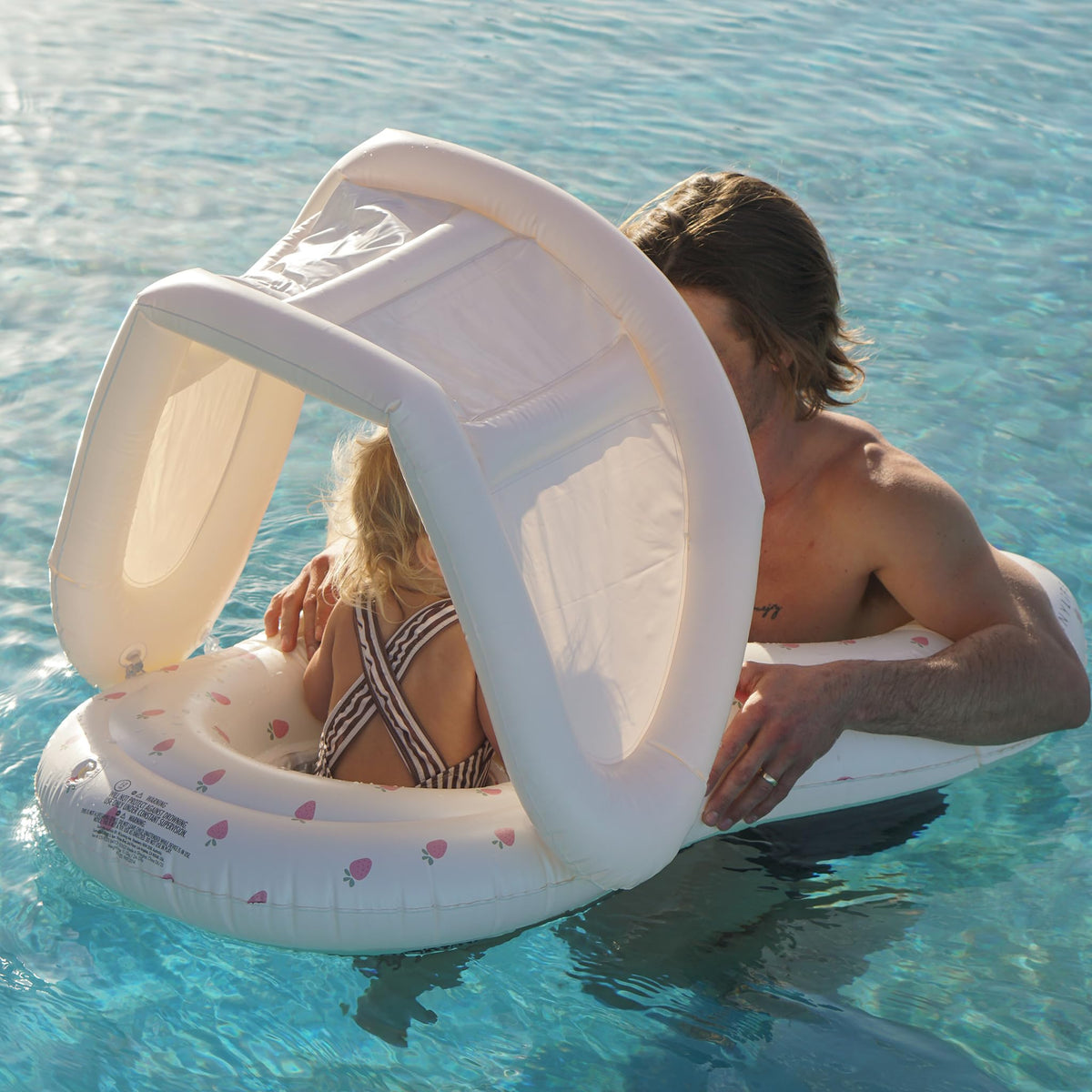 Sunnylife Float Together Baby Seat Strawberry Sunshine head rest supports little head during transition.