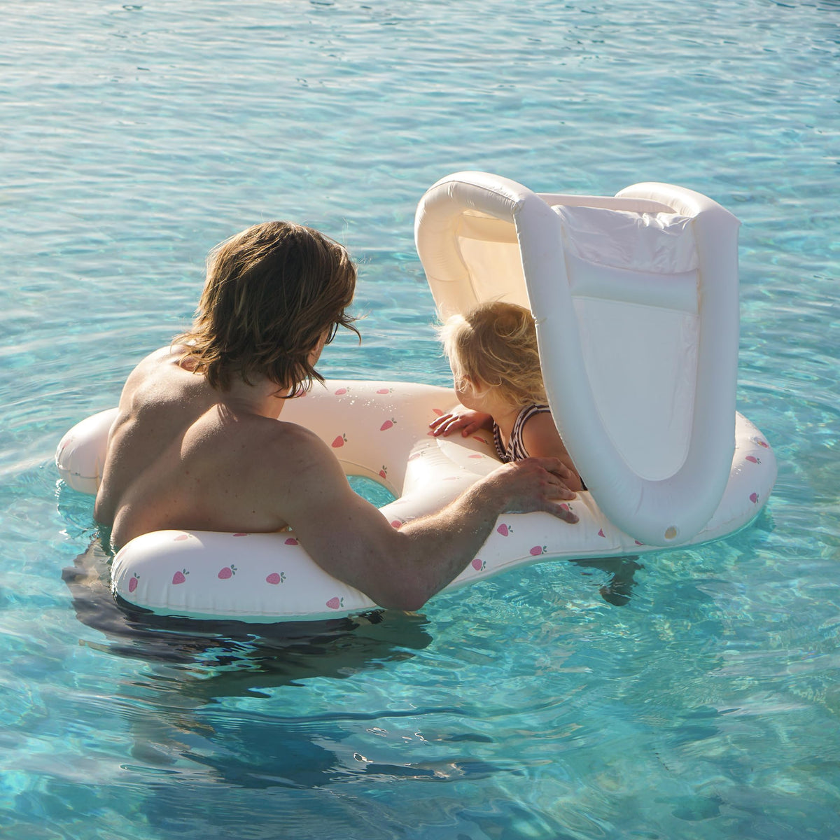 Sunnylife Float Together Baby Seat Strawberry Sunshine soft leg support keeps baby comfy.