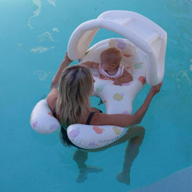 Sunnylife Float Together Baby Seat upright-support design keeps baby elevated.