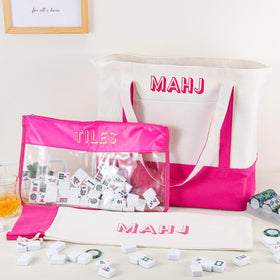 Sunnymove embroidery detail on pink mahjong bag adds stylish flair.