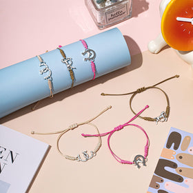 Sureio adjustable rope bracelet close-up showcases durable weave and pendants